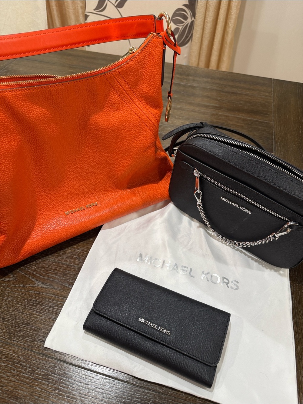 3 Michael Kors pieces: Orange Pebbled Leather Shoulder Hobo, Crossbody, & Wallet